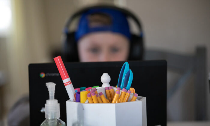 A student works on a home schooling project in New Rochelle, New York, on March 18, 2020. (John Moore/Getty Images)