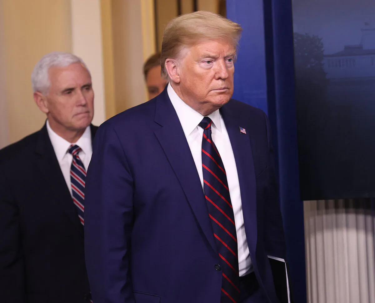 President Donald Trump walks into the press briefing room with members of the White House Coronavirus Task Force at the White House in Washington on April 2, 2020. (Win McNamee/Getty Images)