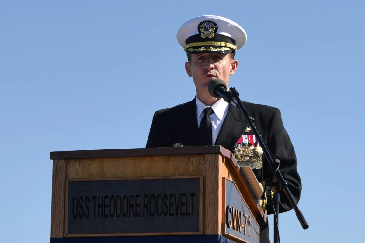 Captain Brett Crozier addresses the crew for the first time as commanding officer of the aircraft carrier USS Theodore Roosevelt during a change of command ceremony on the ship’s flight deck in San Diego, Calif., on Nov. 1, 2019. (U.S. Navy/Mass Communication Specialist 3rd Class Sean Lynch/Handout via Reuters)