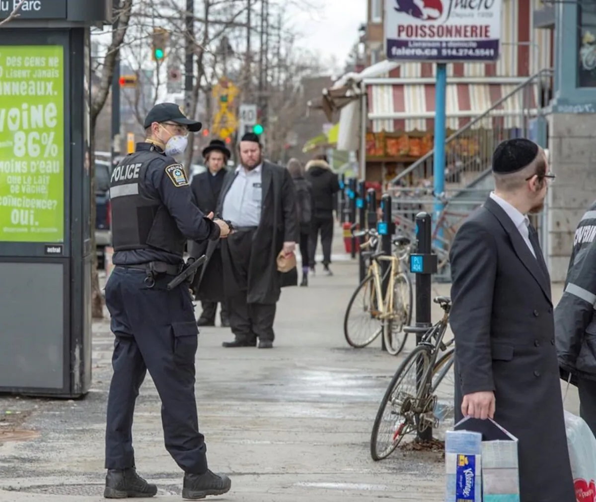 Police keep an eye on social distancing in Montreal, Canada, on April 3, 2020. (Ryan Remiorz/The Canadian Press)