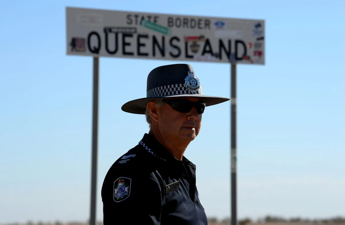 This picture taken on August 30, 2018 shows Australian police Senior Constable Stephan Pursell watching traffic approaching from South Australia at the remote Queensland border outside Birdsville. - In this isolated, arid, ferrous-red-and-orange moonscape fringing the Simpson Desert, dust, pesky flies, feral camels, wild dogs and deadly snakes are your main companions. (SAEED KHAN/AFP via Getty Images)