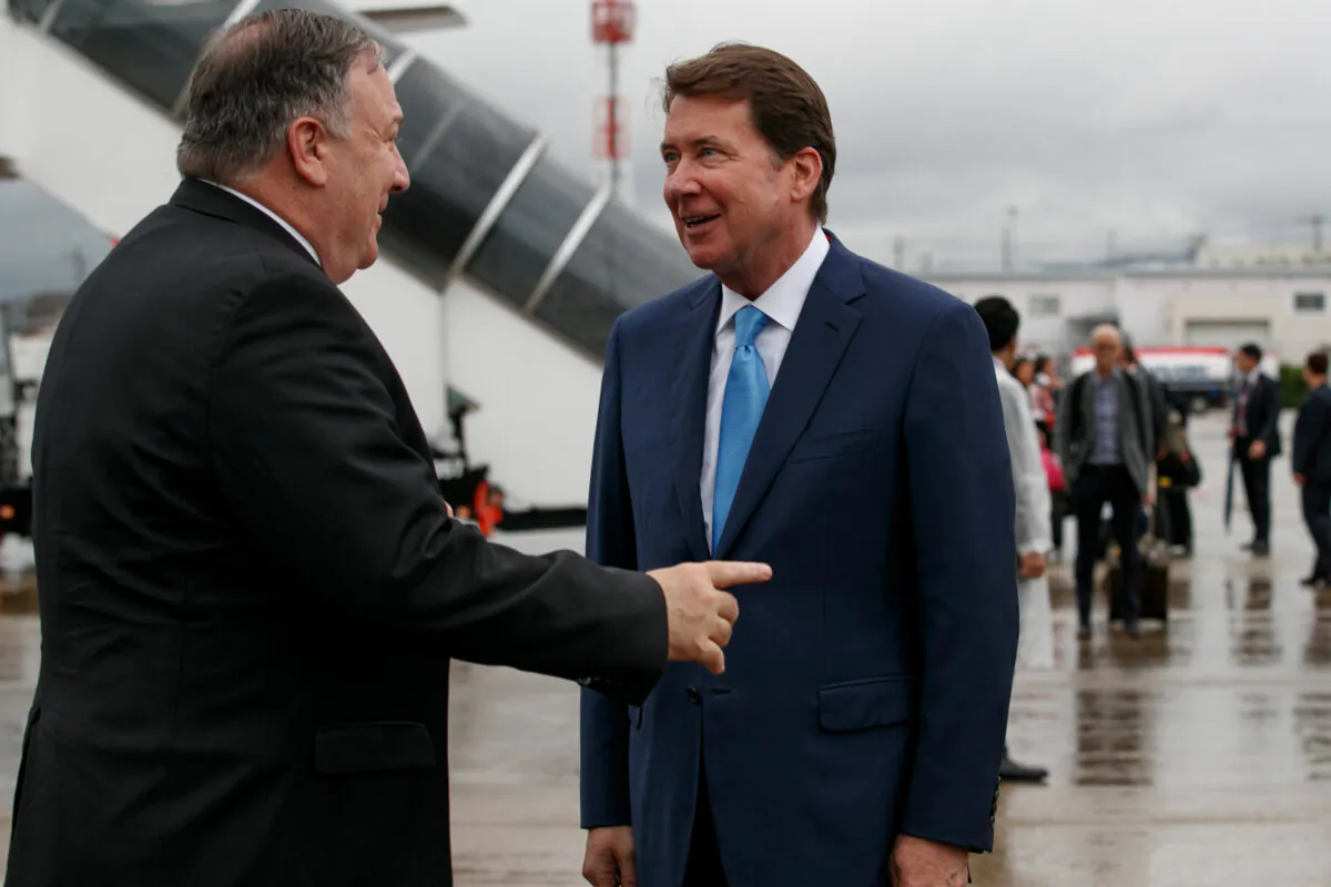 Secretary of State Mike Pompeo (L) talks with then-US Ambassador to Japan Bill Hagerty as he arrives in Osaka on June 27, 2019. (Jacquelyn Martin/AFP via Getty Images)