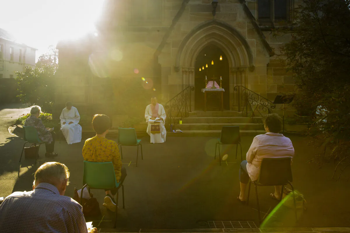 Father James Collins holds a service in the yard of St Paul's Anglican Church in Burwood with seating observant of social distancing on March 22, 2020 in Sydney, Australia.  (Jenny Evans/Getty Images)