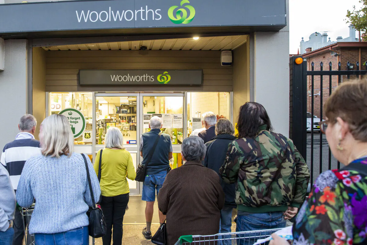 Customers wait outside a Woolworths supermarket on in Sydney, Australia, March 17, 2020. (Jenny Evans/Getty Images)