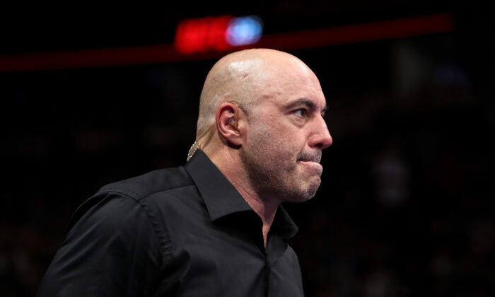 Joe Rogan enters the octagon during the UFC 225: Whittaker v Romero 2 event at the United Center in Chicago, Illinois, on June 9, 2018. (Dylan Buell/Getty Images)