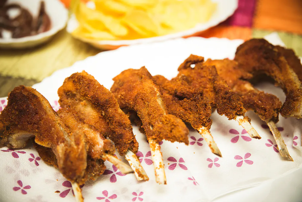 Fried lamb chops, served piping hot. (Clemente lasala/Shutterstock)