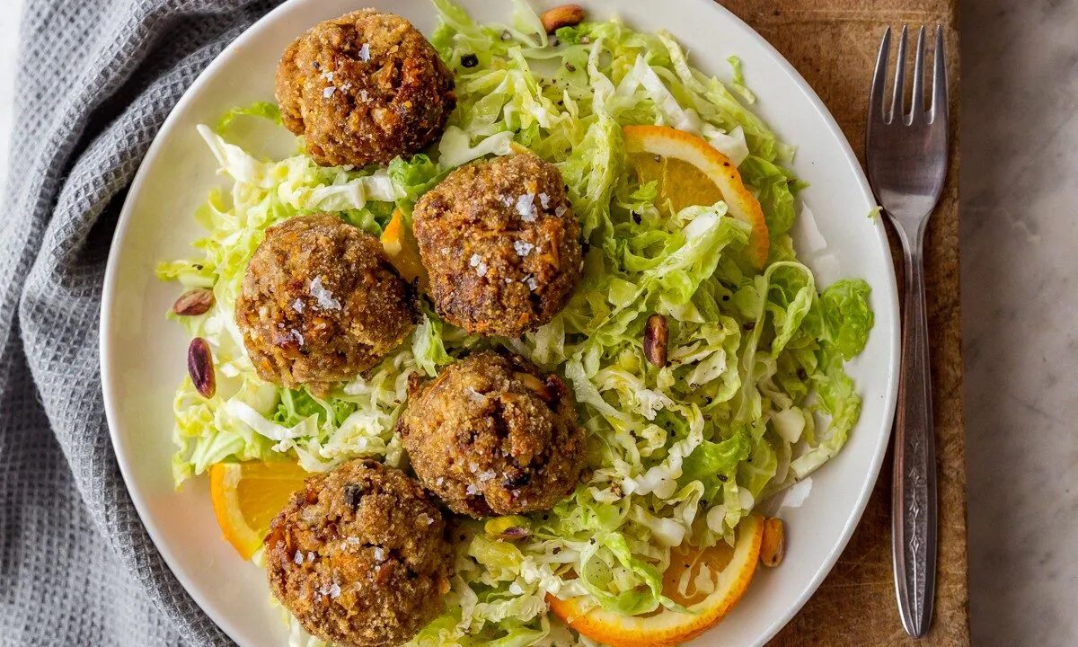 Lamb meatballs with pistachio pesto and a shredded cabbage salad. (Giulia Scarpaleggia)
