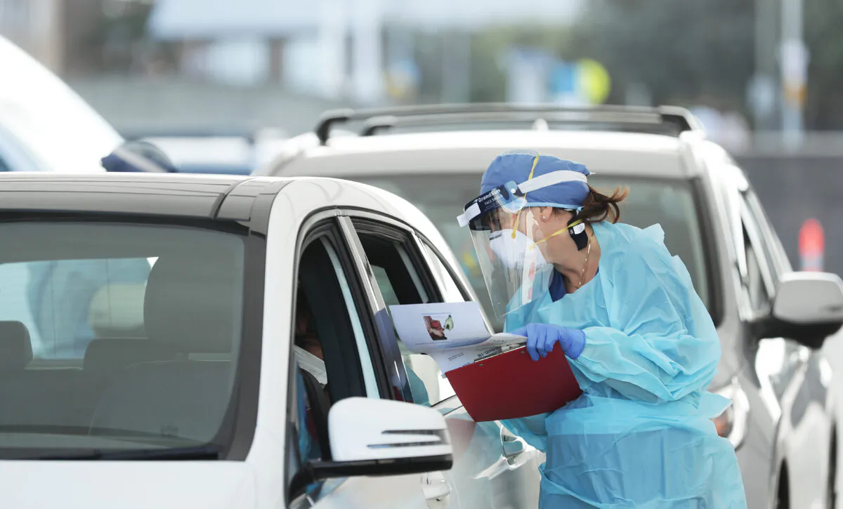 Medical professionals administer COVID-19 tests at the Bondi Beach drive-through COVID-19 testing center on April 6, 2020 in Sydney, Australia. (Mark Metcalfe/Getty Images)