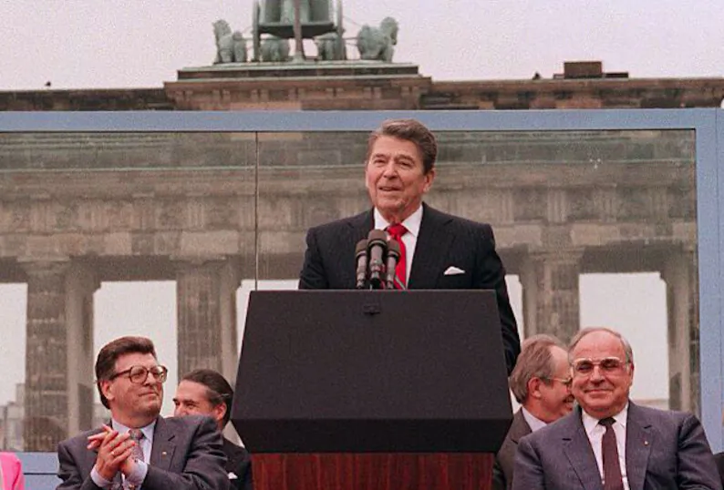 President Ronald Reagan addresses the people of West Berlin at the base of the Brandenburg Gate on June 12, 1987. "Tear down this wall!" were the famous words Reagan said to Soviet leader Mikhail Gorbachev. The address is considered by many to have affirmed the beginning of the end of the Cold War and the fall of communism. (MIKE SARGENT/AFP via Getty Images)