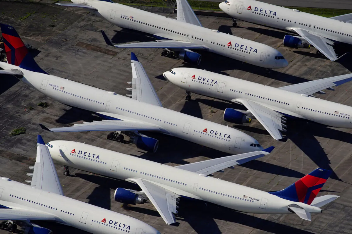 Delta Air Lines passenger planes are seen parked due to flight reductions made to slow the spread of COVID-19, at Birmingham-Shuttlesworth International Airport in Birmingham, Ala., on March 25, 2020. (Elijah Nouvelage/Reuters)