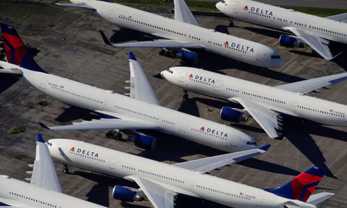 Delta Air Lines passenger planes are seen parked due to flight reductions made to slow the spread of COVID-19, at Birmingham-Shuttlesworth International Airport in Birmingham, Ala., on March 25, 2020. (Elijah Nouvelage/Reuters)