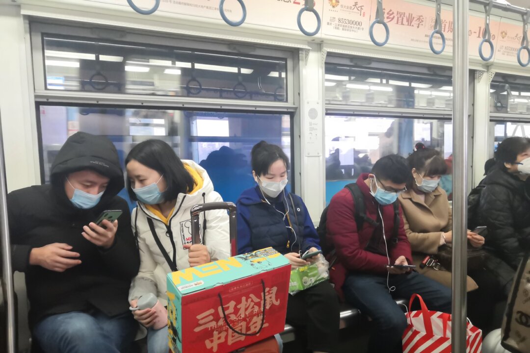 Wearing a mask is especially advised for crowded places like buses and subway cars. (helloabc/Shutterstock)