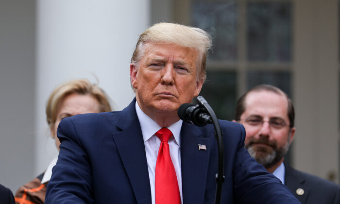 President Donald Trump, flanked by officials and business leaders, announces a national emergency with regard to the CCP virus in the White House Rose Garden in Washington on March 13, 2020. (Charlotte Cuthbertson/The Epoch Times)