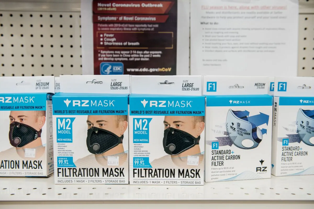 Signs detailing the Center for Disease Control's advice for combatting Coronavirus are displayed above facemasks at a Manhattan hardware store in New York City on Feb. 26, 2020 in New York City. (Scott Heins/Getty Images)