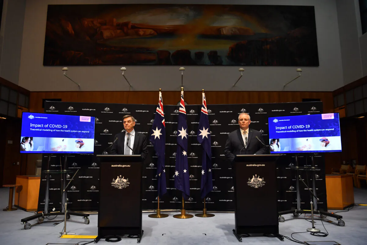 Prime Minister Scott Morrison (R) and Chief Medical Officer Brendan Murphy during a press conference in the Main Committee Room at Parliament House in Canberra, Australia, on April 07, 2020.  (Sam Mooy/Getty Images)