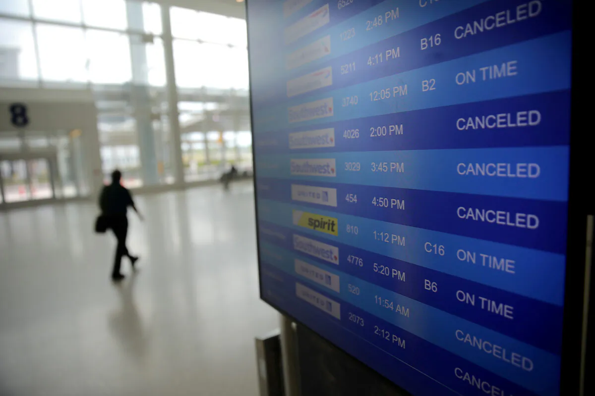 Canceled flights are seen on an airport screen in New Orleans, Louisiana on April 4, 2020. (Carlos Barria/File Photo/Reuters)