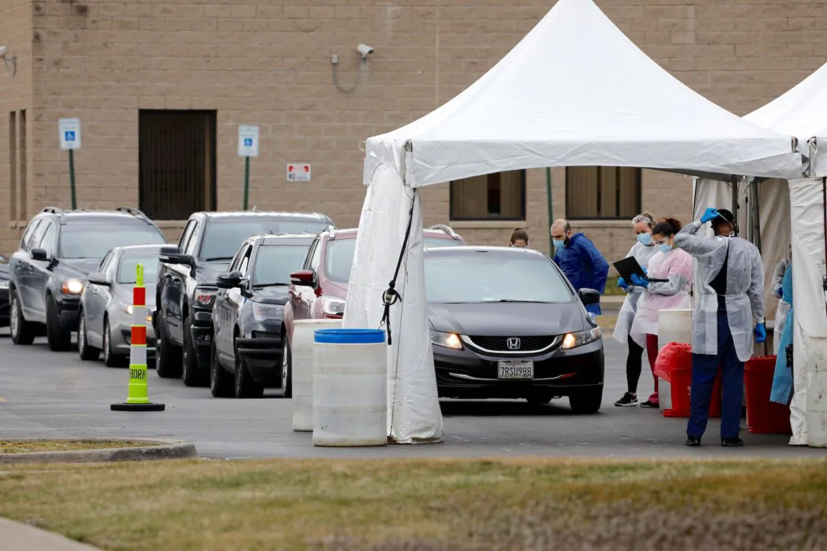 People are tested for COVID-19 at a mobile testing center in Dearborn, Michigan, on March 26, 2020. (Jeff Kowalsky/AFP/Getty Images)