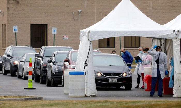 People are tested for COVID-19 at a mobile testing center in Dearborn, Michigan, on March 26, 2020. (Jeff Kowalsky/AFP/Getty Images)
