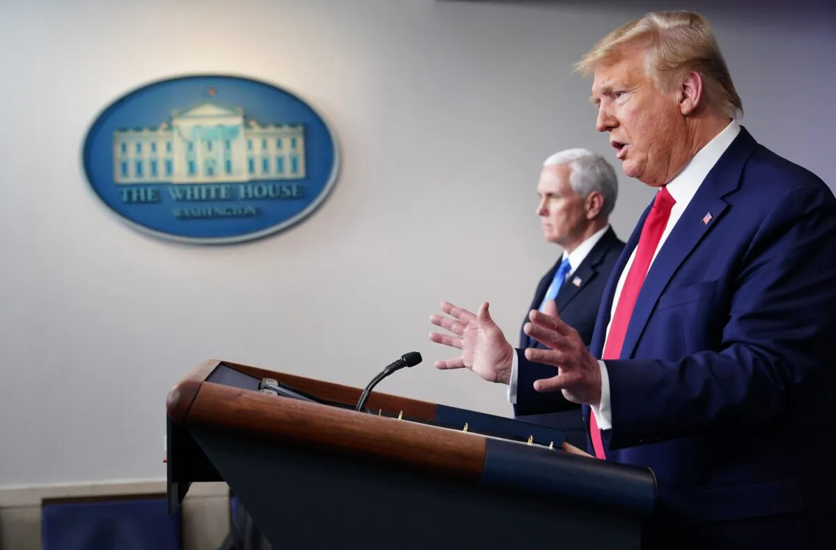 President Donald Trump flanked by Vice President Mike Pence speaks during the daily briefing on the CCP virus in the Brady Briefing Room at the White House on April 6, 2020. (Mandel Ngan/AFP via Getty Images)