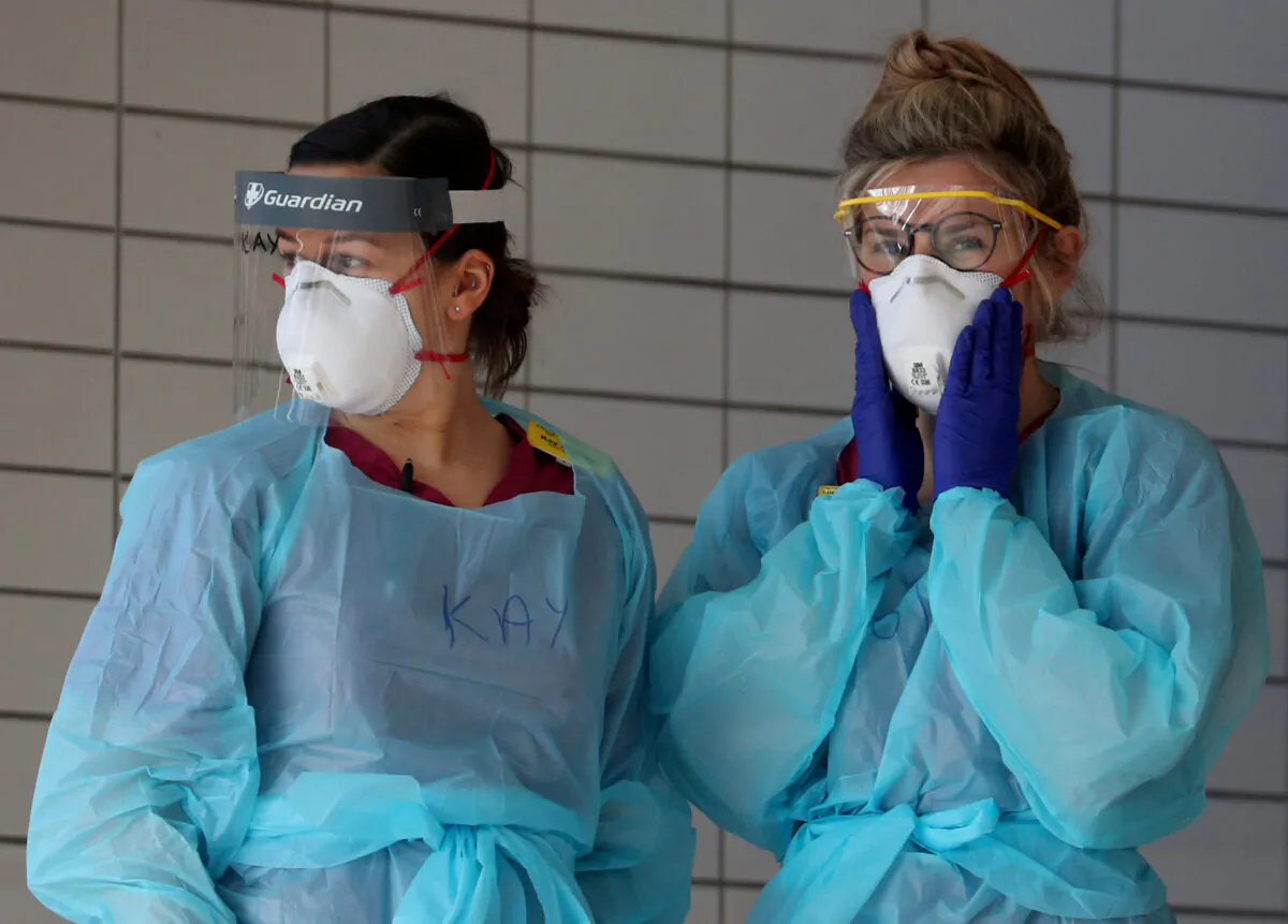 Medical staff wearing protective clothing at St Thomas' hospital as the spread of COVID-19 continues, in London on March 31, 2020. (Hannah McKay/Reuters)
