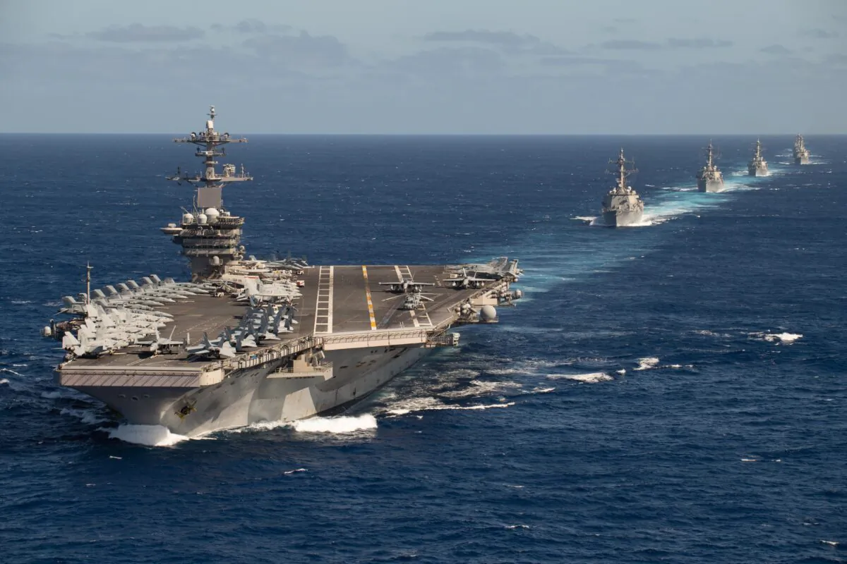The Theodore Roosevelt Carrier Strike Group transits in formation on Jan. 25, 2020. (U.S. Navy photo by Mass Communication Specialist 2nd Class Anthony Rivera/Released)200125-N-XC372-1100