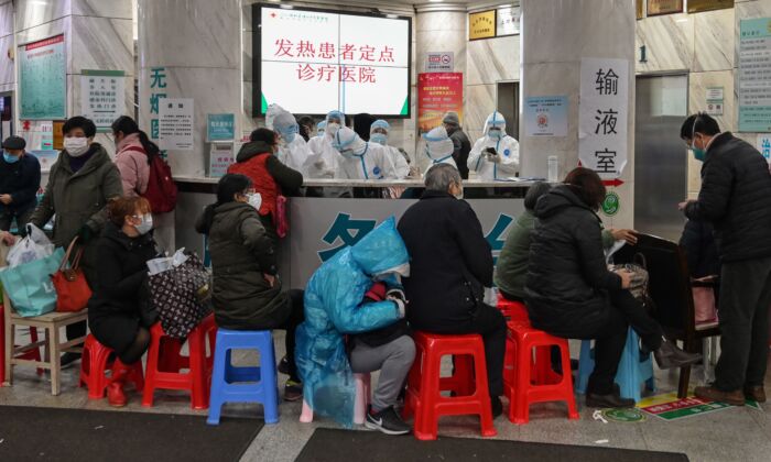Patients wait for treatment at Wuhan Red Cross Hospital in Wuhan, China on Jan. 24, 2020. (Hector Retamal/AFP via Getty Images)