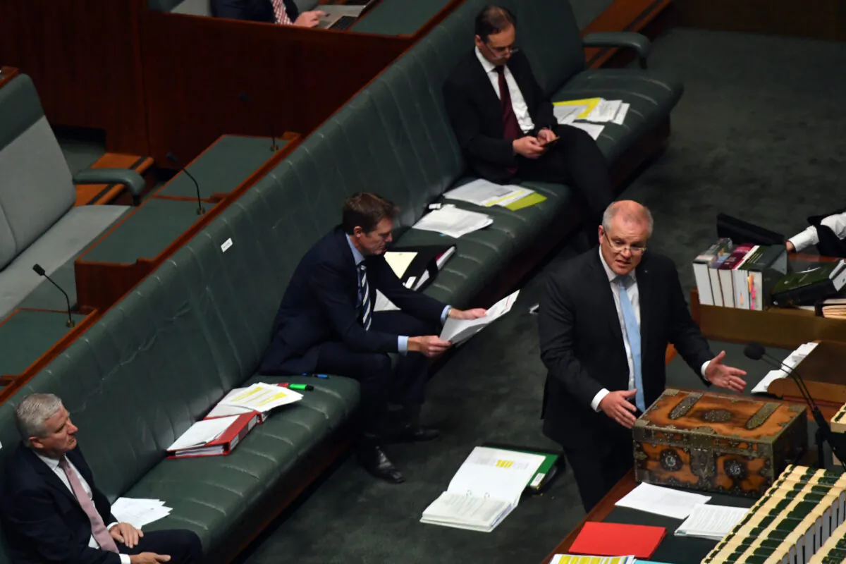 CANBERRA, AUSTRALIA - APRIL 08: Prime Minister Scott Morrison speaks at the despatch box during Question Time in the House of Representatives at Parliament House on April 08, 2020 in Canberra, Australia. The government’s $130bn AUD Coronavirus Economic Response Bill will be put to parliament today .(Sam Mooy/Getty Images)