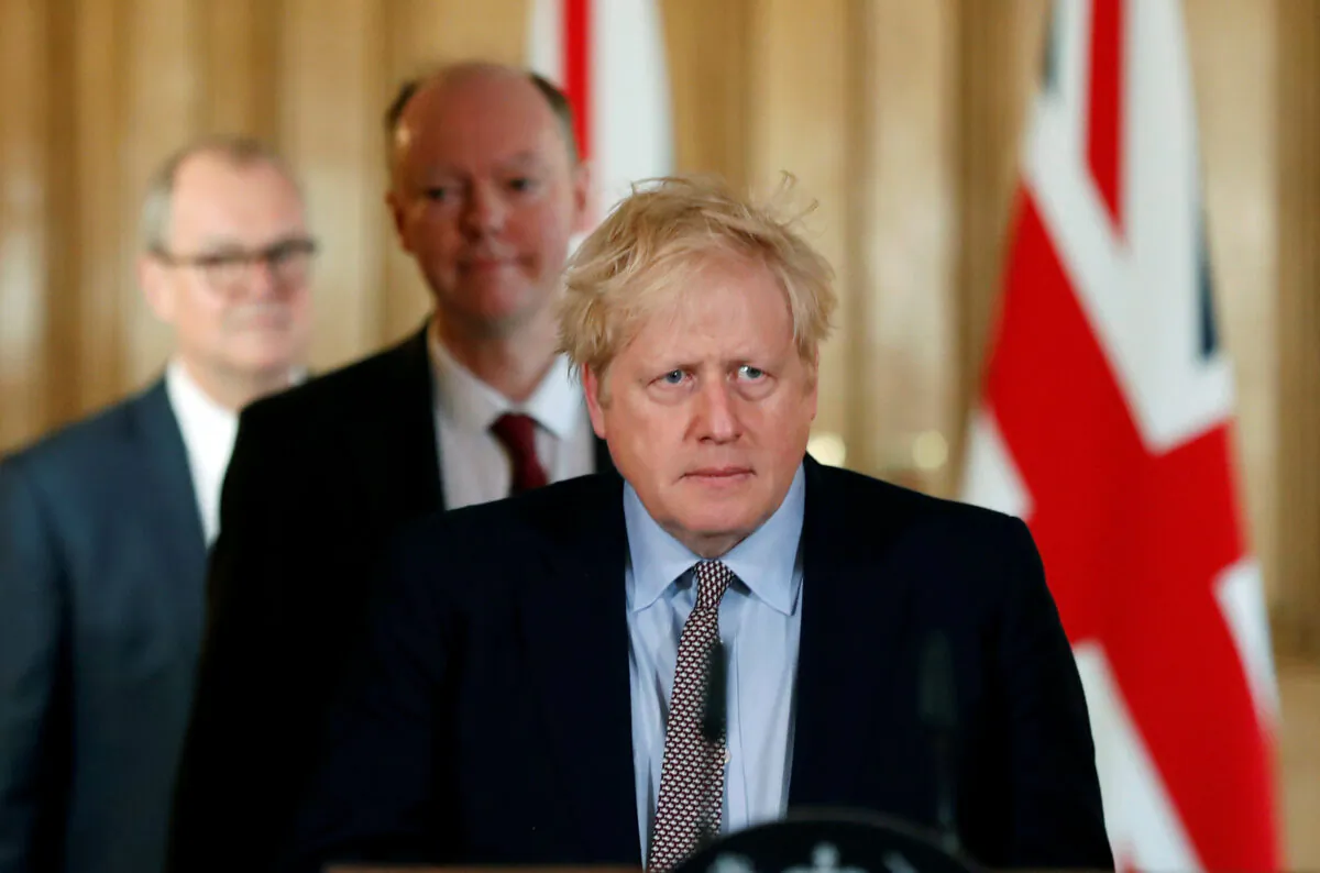 UK Prime Minister Boris Johnson, Chris Whitty, Chief Medical Officer for England and Chief Scientific Adviser to the Government, Sir Patrick Vallance, arrive for a news conference on the CCP virus, in London on March 3, 2020. (Frank Augstein/Pool via Reuters)