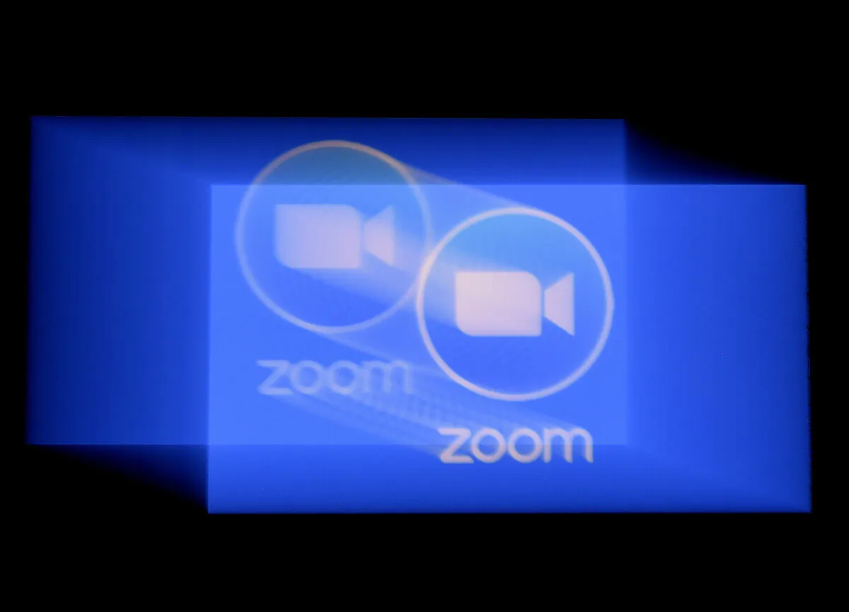 In this photo illustration a Zoom App logo is displayed on a smartphone on March 30, 2020 in Arlington, Virginia. (OLIVIER DOULIERY/AFP via Getty Images)