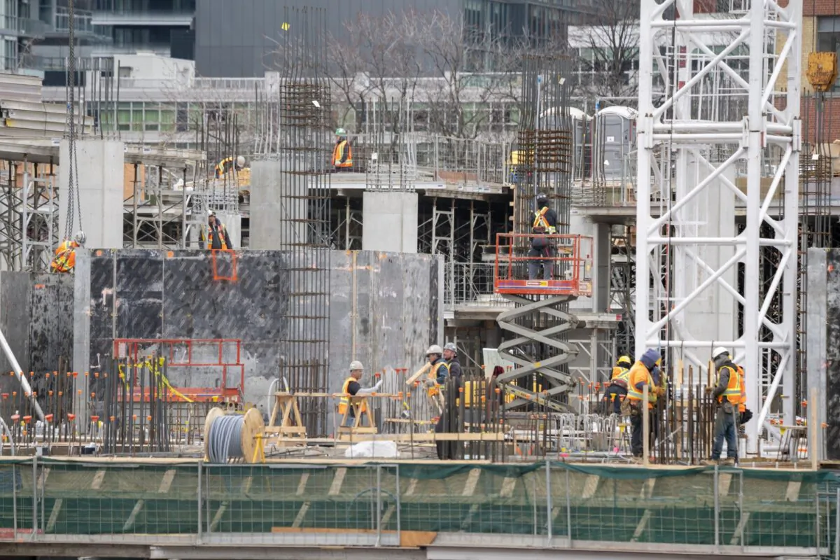 Workers at a construction site in Toronto on March 18, 2020. (Frank Gunn/The Canadian Press)