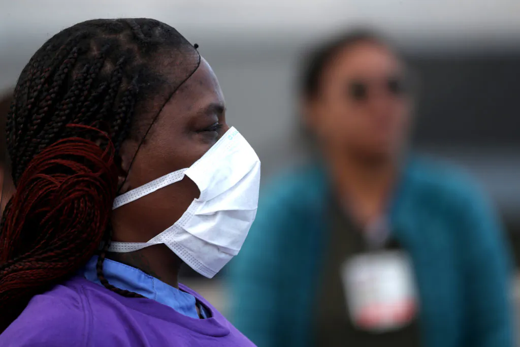Alameda Health System nurses, doctors, and workers demonstrate for better working conditions in front of Highland Hospital in Oakland, Calif., on March 26, 2020. (Justin Sullivan/Getty Images)