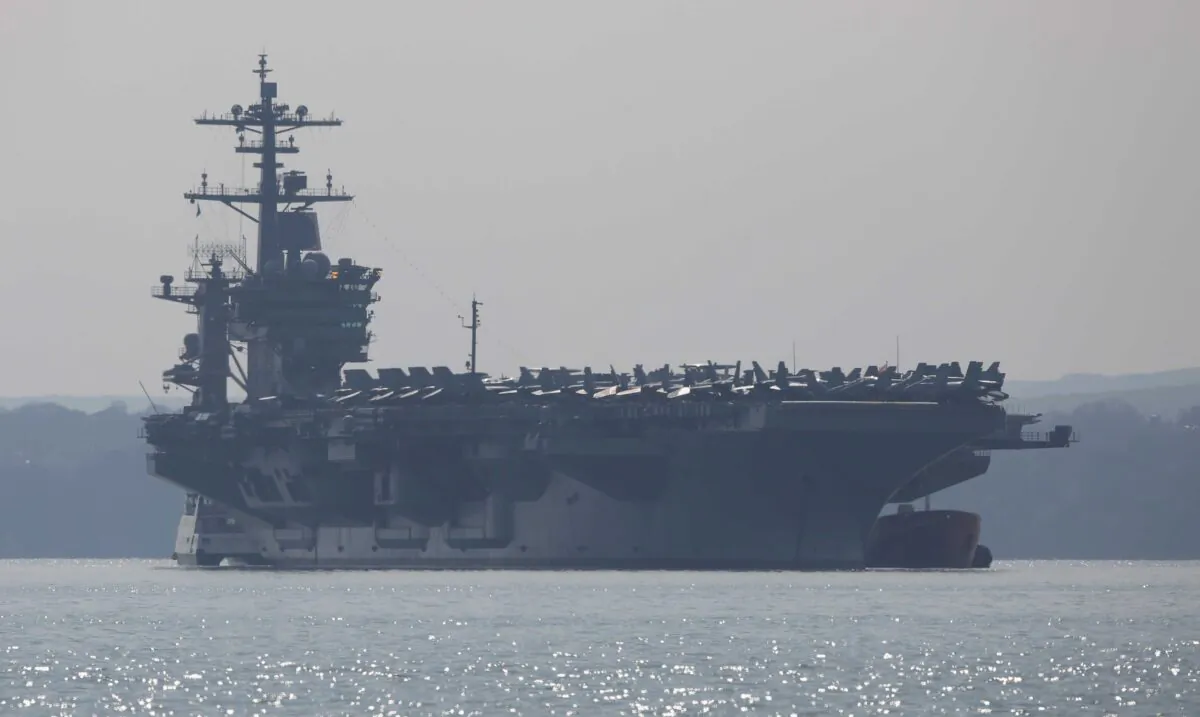 The USS Theodore Roosevelt anchors off the coast in Gosport, England, on March 23, 2015. (Dan Kitwood/Getty Images)