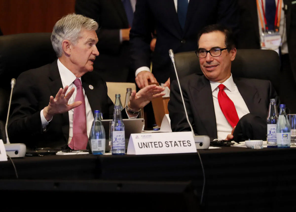 Federal Reserve Chairman Jerome Powell (L) talks with Treasury Secretary Steven Mnuchin during a G20 meeting in Fukuoka, Japan, on June 8, 2019. (Kim Kyung-Hoon/AFP/Getty Images)

