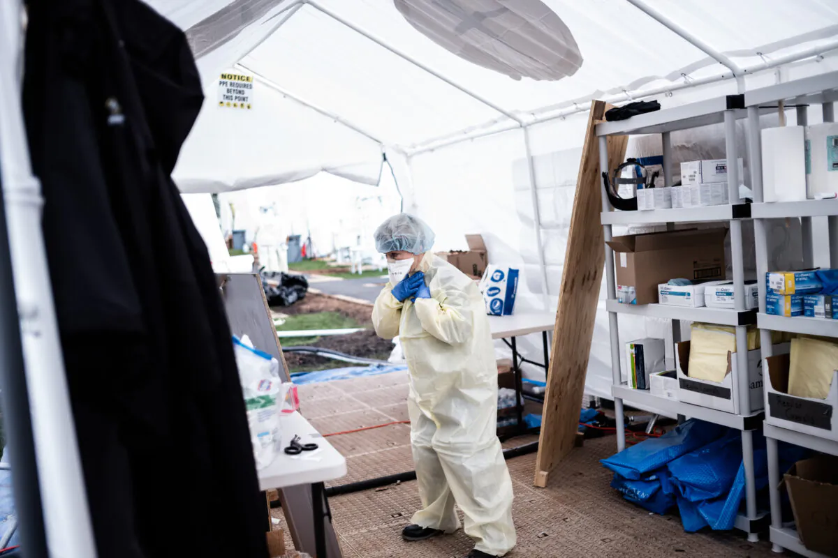 Medical workers putting on equipment at the beginning of their shift at the emergency field hospital run by Samaritan's Purse and Mount Sinai Health System in Central Park in New York City on April 8, 2020. (Misha Friedman/Getty Images)