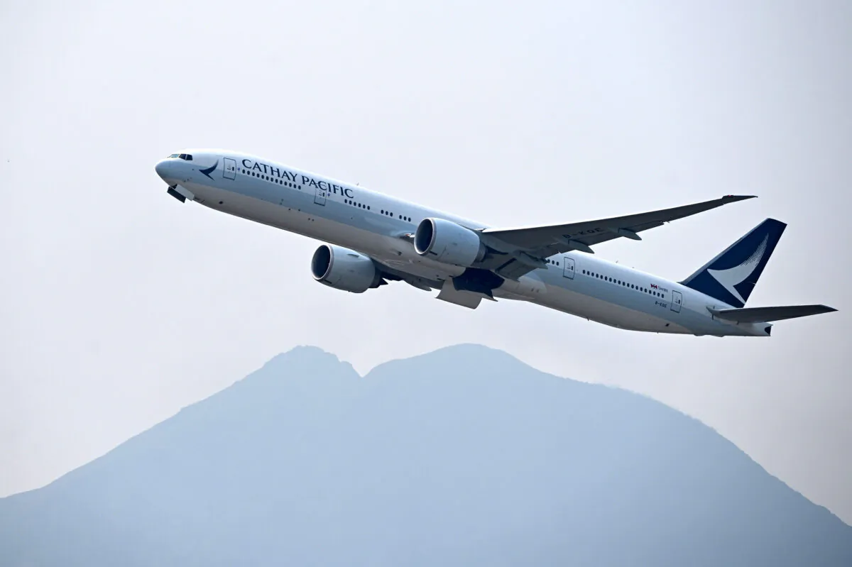 A Cathay Pacific passenger plane takes off from Hong Kong's international airport on March 13, 2019. (Anthony Wallace/AFP/Getty Images)