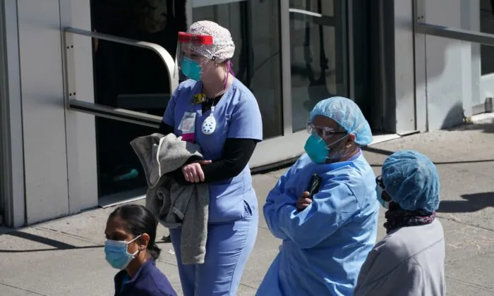 Medical staff listen as Montefiore Medical Center nurses call for N95 masks and other critical PPE to handle the coronavirus (COVID-19) pandemic in New York on April 1, 2020. (Bryan R. Smith/AFP/Getty Images)