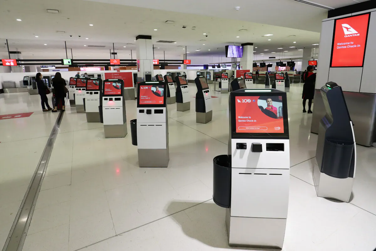 The Qantas check in area is seen empty at Sydney International Airport on March 19, 2020 in Sydney, Australia. Qantas has announced it will ground its entire international fleet, including overseas Jetstar . ( Mark Metcalfe/Getty Images)
