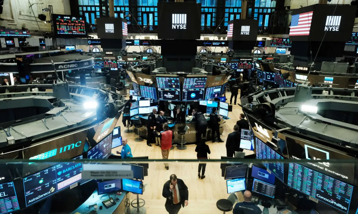 Traders work on the floor of the New York Stock Exchange (NYSE) in New York City on March 20, 2020. (Spencer Platt/Getty Images)