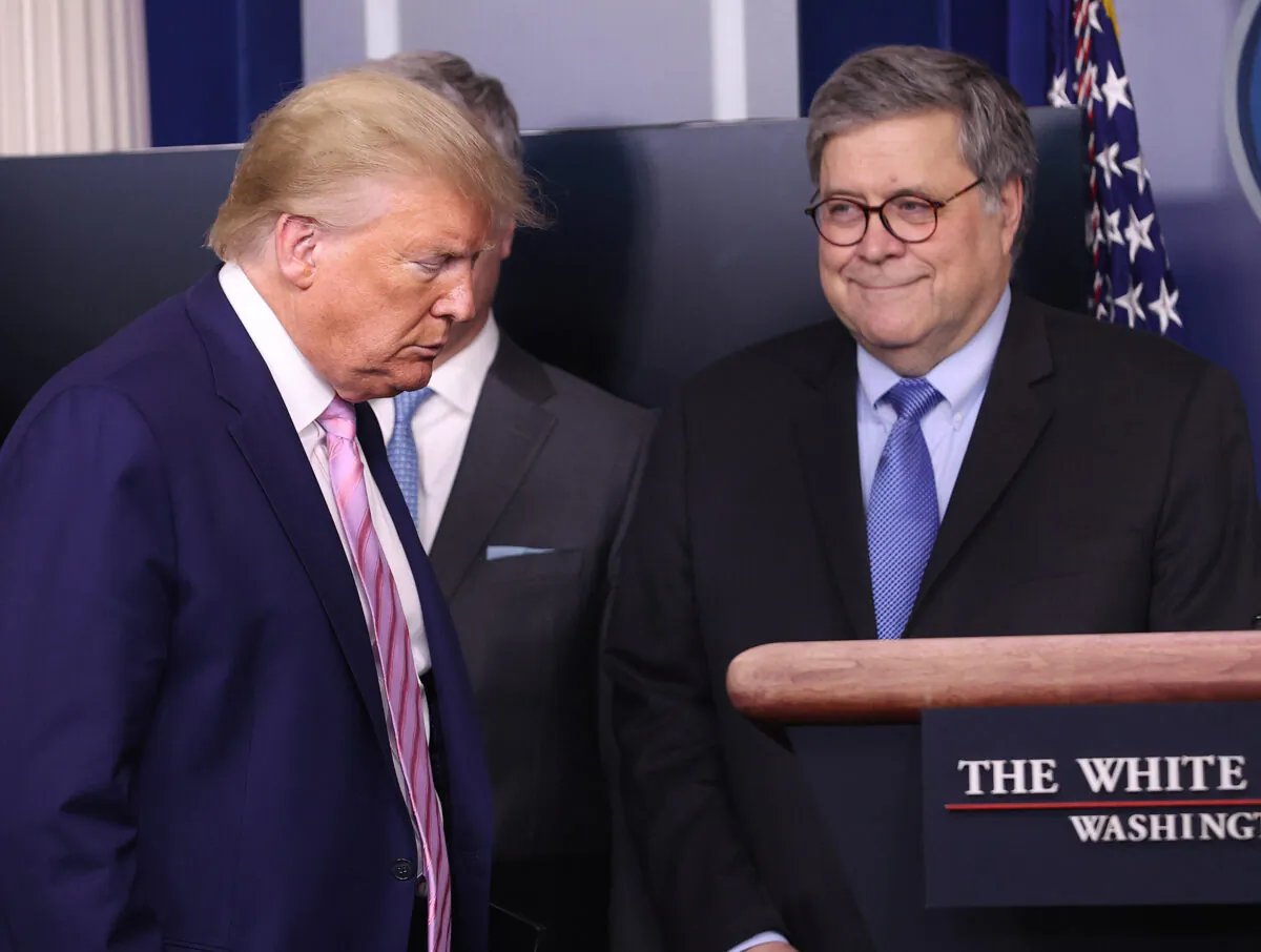 President Donald Trump arrives at the press briefing room flanked by Attorney General William Barr and other administration officials in Washington on April 1, 2020. (Win McNamee/Getty Images)