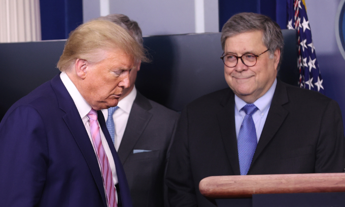 President Donald Trump arrives at the press briefing room flanked by Attorney General William Barr and other administration officials in Washington on April 1, 2020. (Win McNamee/Getty Images)