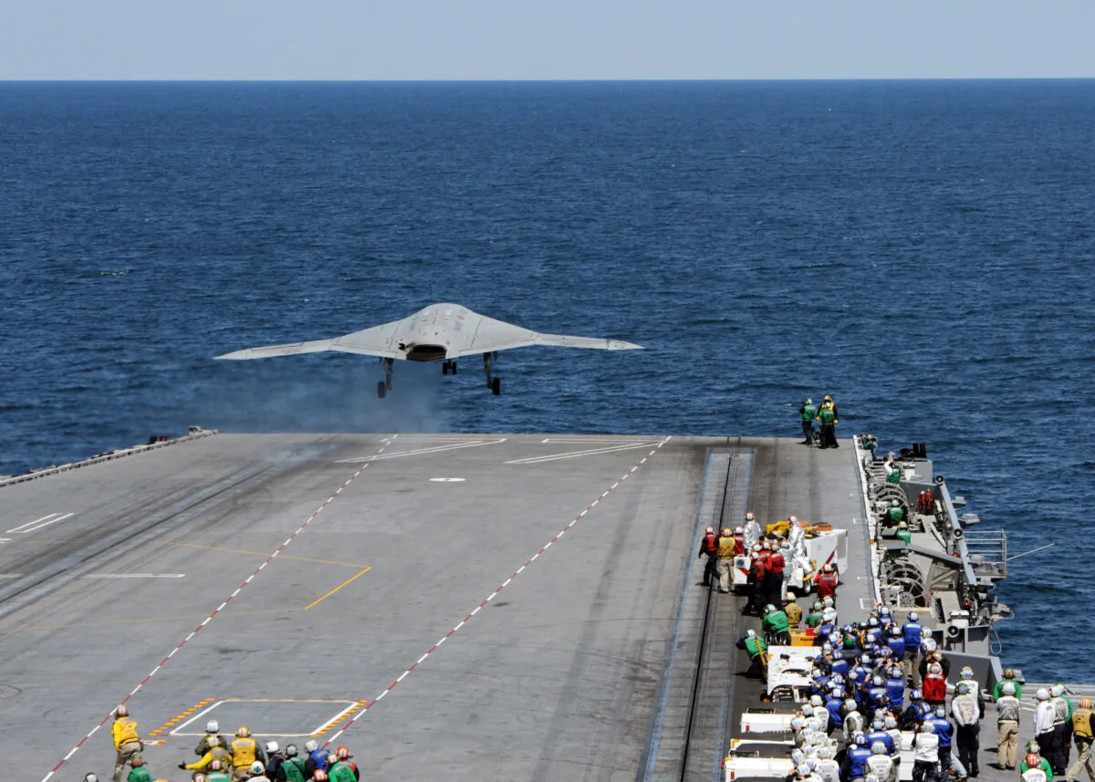 An X-47B Unmanned Combat Air System (UCAS) demonstrator launches from the flight deck of the aircraft carrier USS George H.W. Bush (CVN 77) on May 14, 2013. (U.S. Navy via Getty Images)