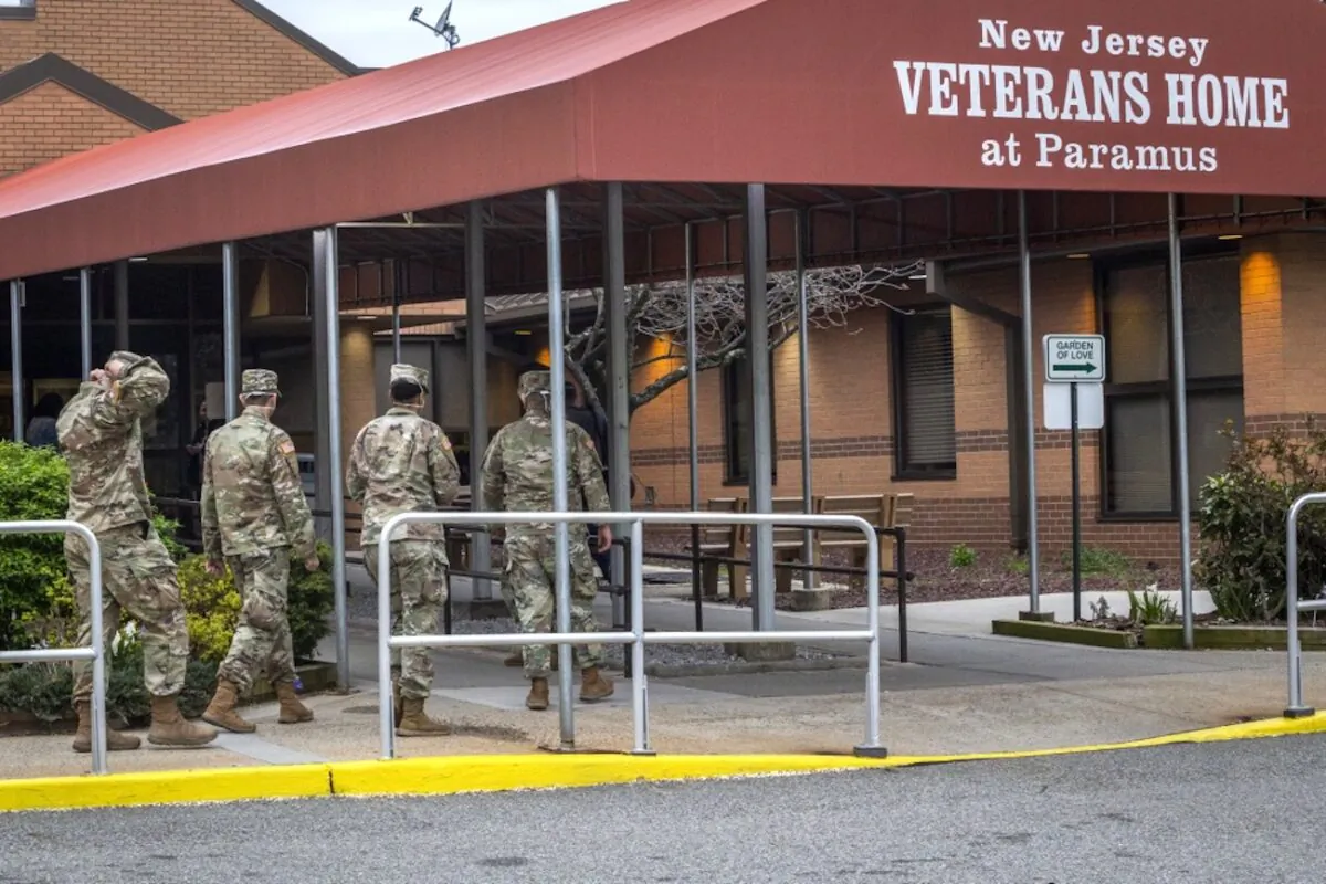 New Jersey Army National Guard combat medics enter the New Jersey Veterans Home at Paramus, N.J., April 9, 2020. (Mark C. Olsen/New Jersey National Guard)