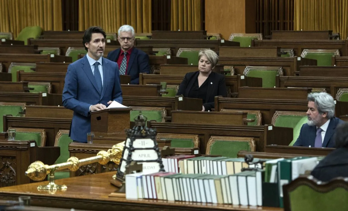 Prime Minister Justin Trudeau rises in the House of Commons on Parliament Hill in Ottawa, as Parliament was recalled for the consideration of measures related to the COVID-19 pandemic, on April 11, 2020. (The Canadian Press/Justin Tang)