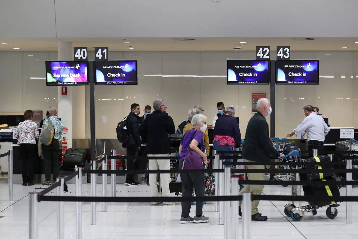 New Zealand passengers from the Vasco Da Gama cruise ship check in for their Air New Zealand flight to Auckland at Perth International Airport .
PERTH, AUSTRALIA - MARCH 28, 2020:(Paul Kane/Getty Images)