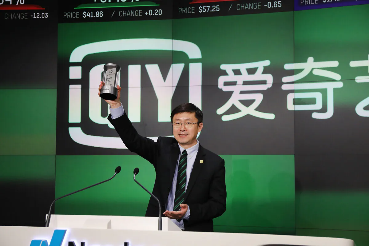 Yu Gong, founder and CEO of China-based streaming service iQiyi, stands at the podium before ringing the Opening Bell at Nasdaq MarketSite in Times Square in celebration of its initial public offering in New York City, on March 29, 2018. (Spencer Platt/Getty Images)