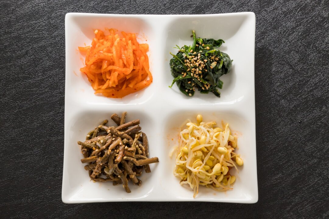 Namul include various unusual roots, leaves, sprouts, legumes, and seaweeds, often seasoned delicately with garlic, sesame, soy sauce, and ginger. (Norikko/Shutterstock)