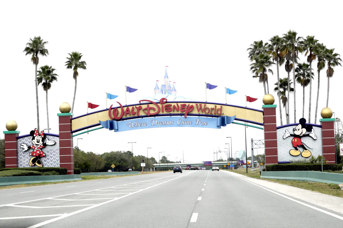 The road to the entrance of Walt Disney World in Lake Buena Vista, Fla., on March 16, 2020. (John Raoux/AP Photo)