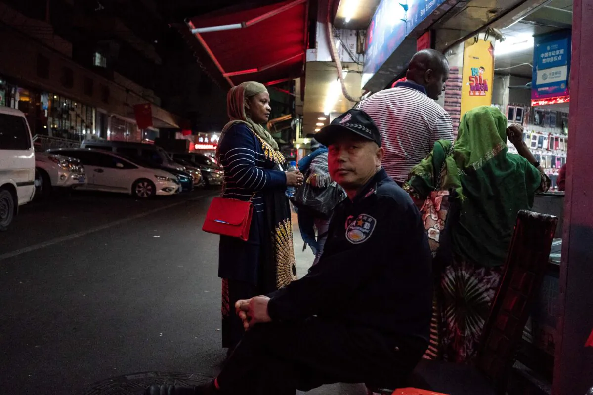 A Chinese security man at the entrance to the "Little Africa" district in Guangzhou, the capital of Guangdong province, China, on March 1, 2018. (FRED DUFOUR/AFP via Getty Images)