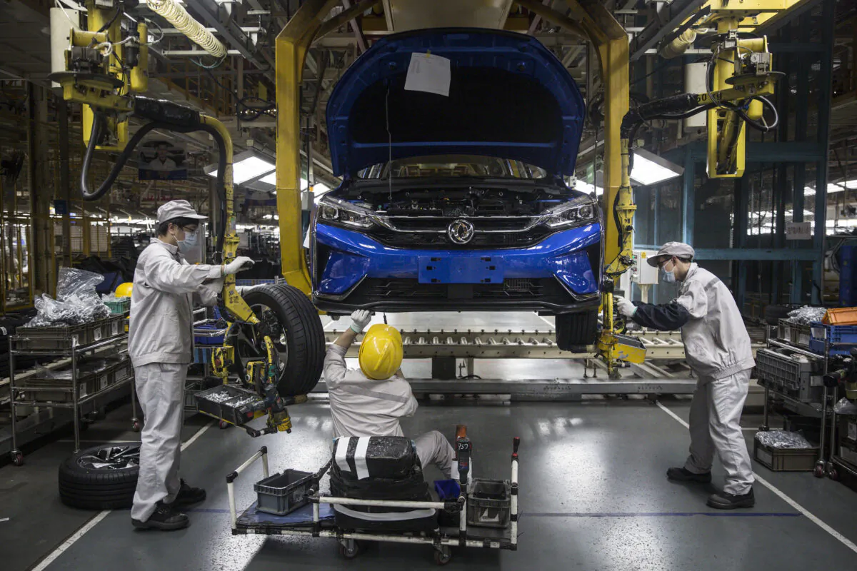 An employee works on the assembly line at the Dongfeng Fengshen plant in Wuhan, Hubei Province, China, on on March 24, 2020. (Getty Images)