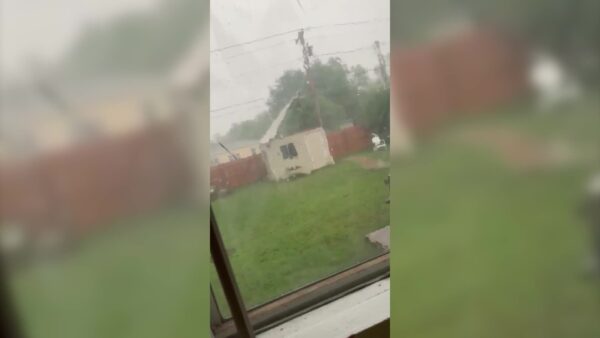 Severe weather tears the roof off a shed